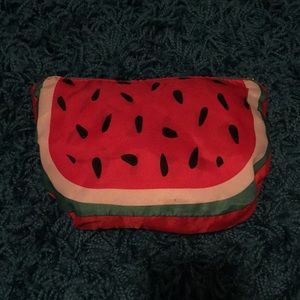A watermelon pouch that turn into a mesh backpack.
